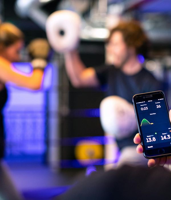 Person in mid-motion during a cardio exercise, blurred background.